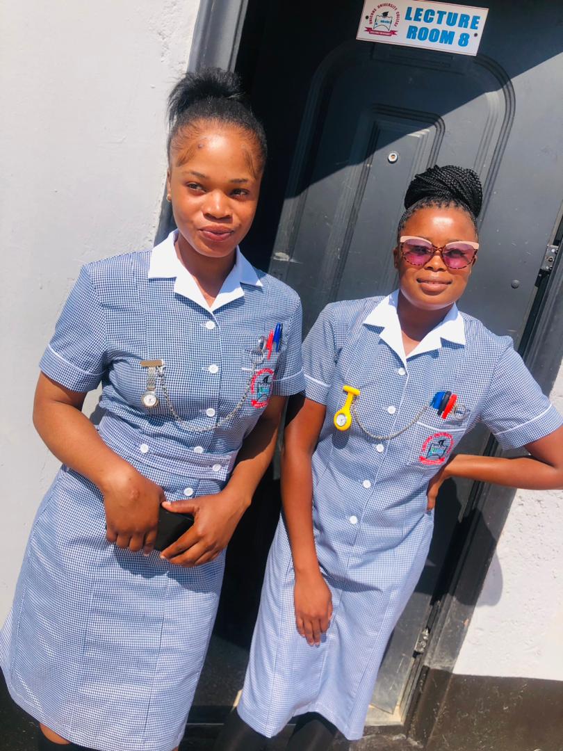 Nursing students outside a lecture room